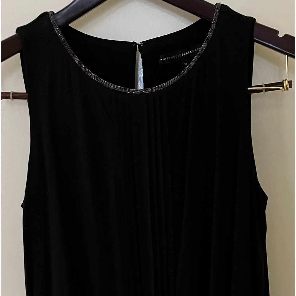 WHBM long black knit top. Pleated front with shimmery neck. Size M